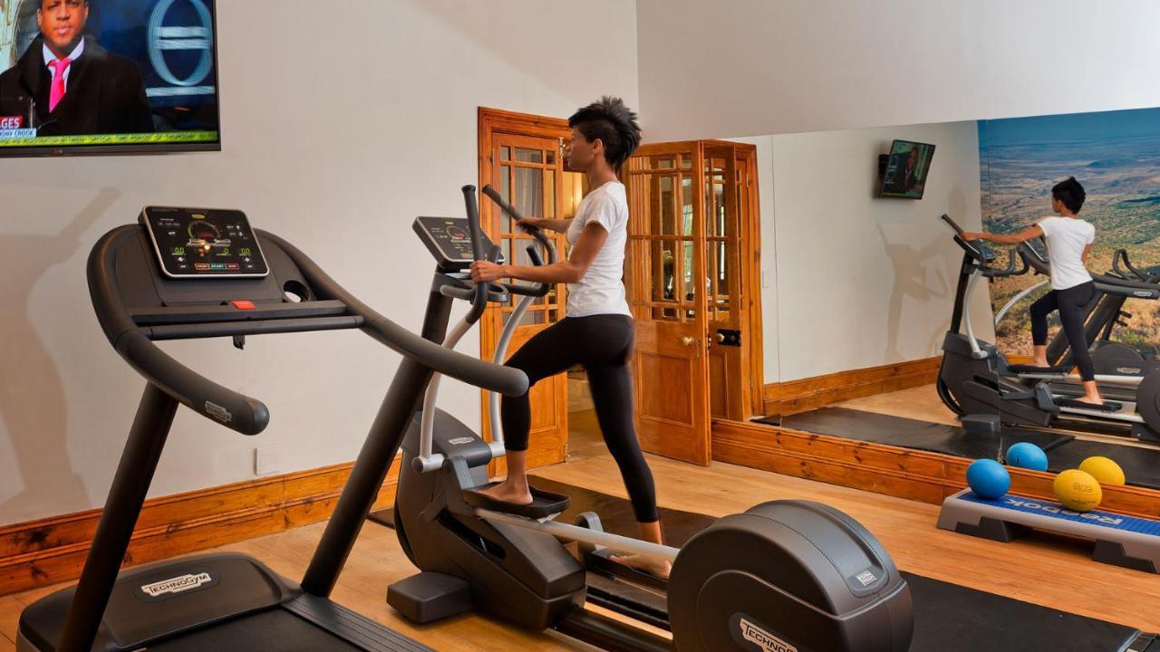 Drostdy Hotel Graaff-Reinet Exterior foto A woman using a cross trainer